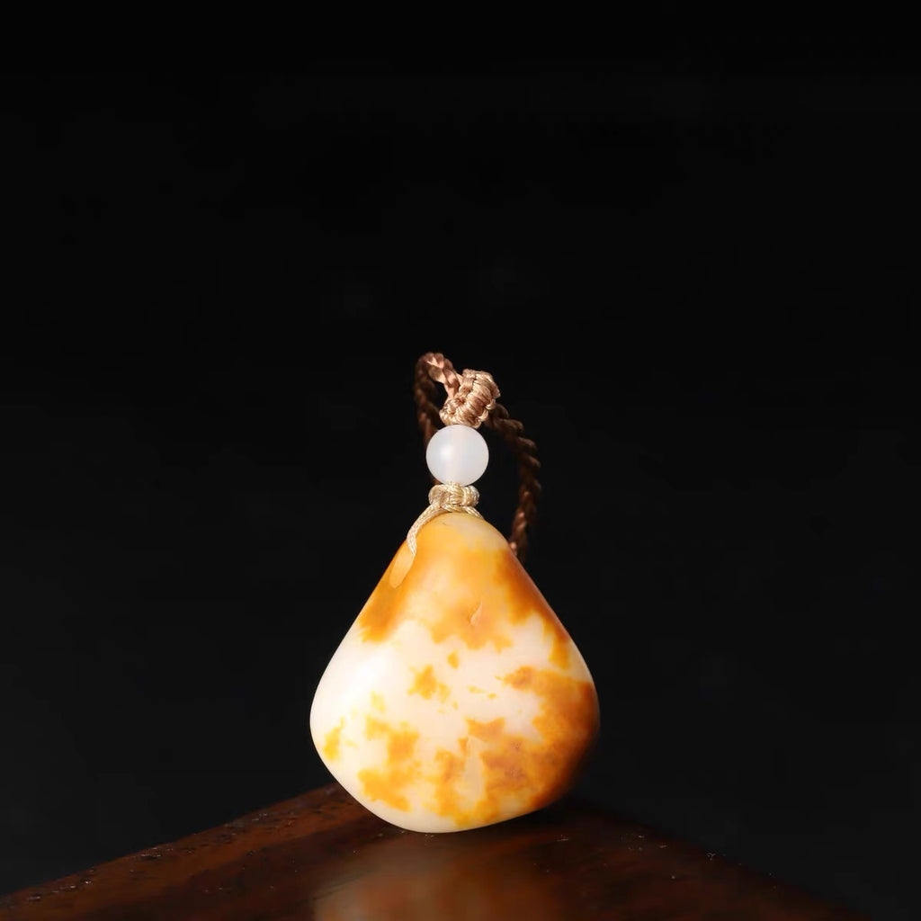 獨籽紅皮白玉原石