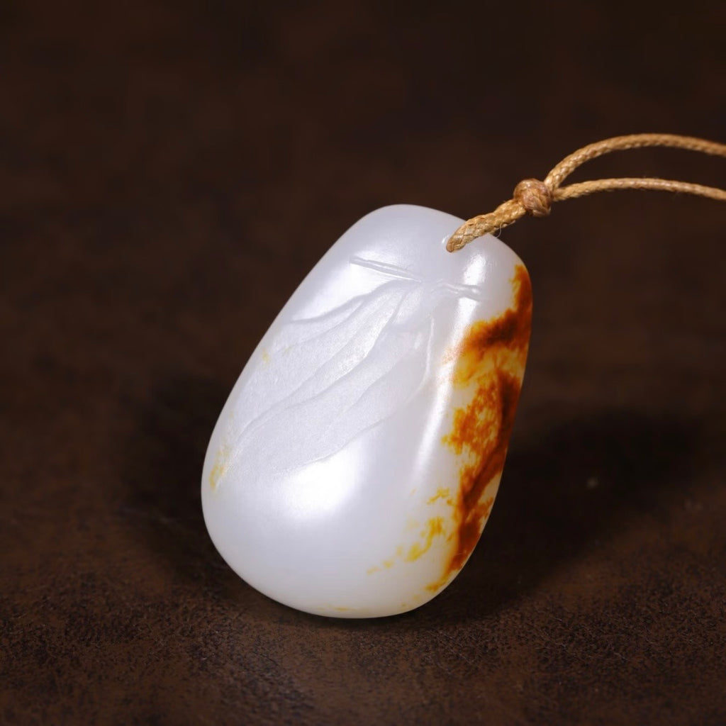 羊脂白紅皮白肉籽料吊墜